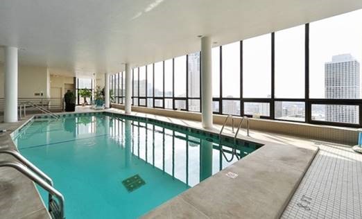 The Carlyle in Chicago features an indoor swimming pool, exercise facilities, his & her steam rooms - Chicago Interior Design