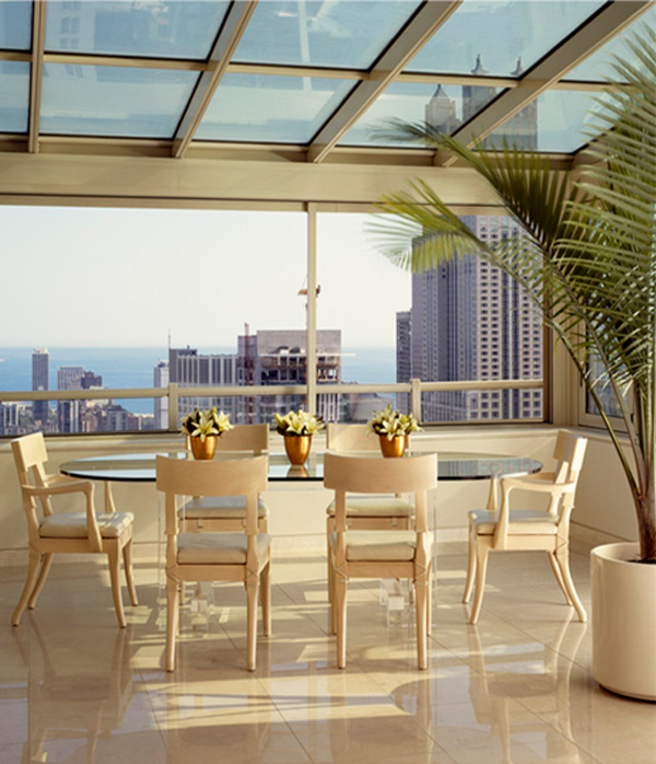 Created by the John Robert Wiltgen Design Team, this 3700 Square-Foot Penthouse Features a Monochromatic Palette and a Glass Enclosed Atrium Dining Room with Enviable Urban Chicago Views